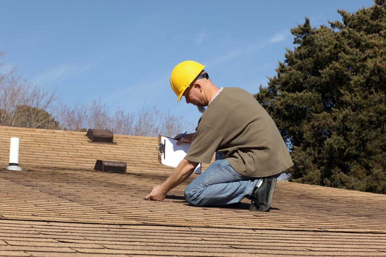 Inspecting Roof Damage | Elevated Roofing
