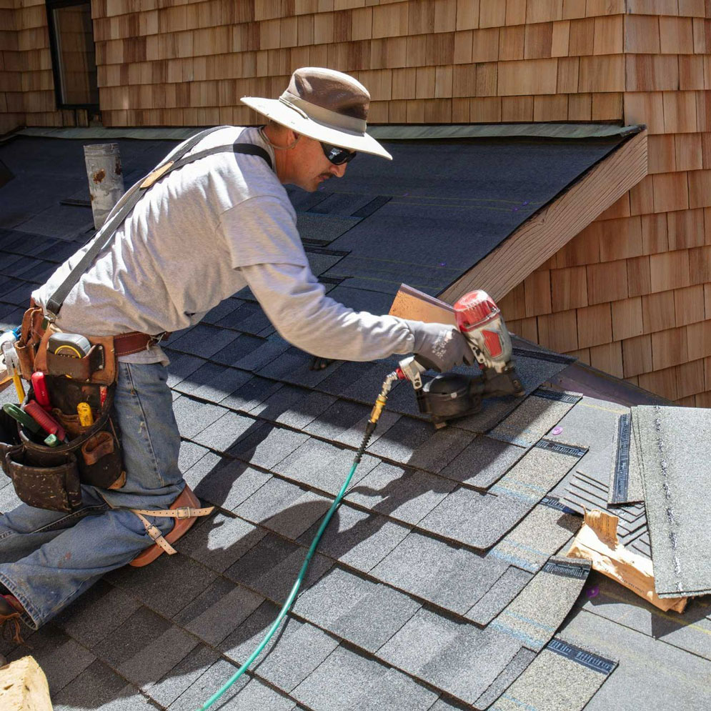 Roofer Repairing Roof | Elevated Roofing